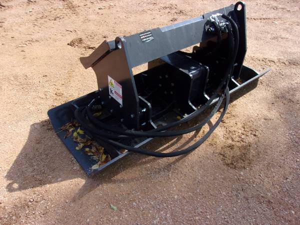 Photo skid loader mount plate compactor - new $2,000
