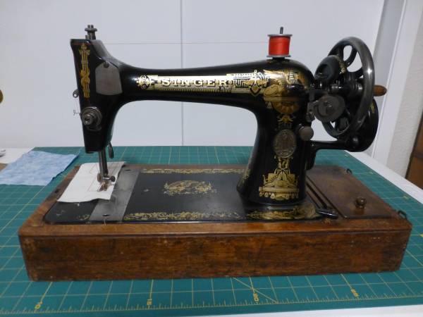 Photo singer hand crank sewing machine $300