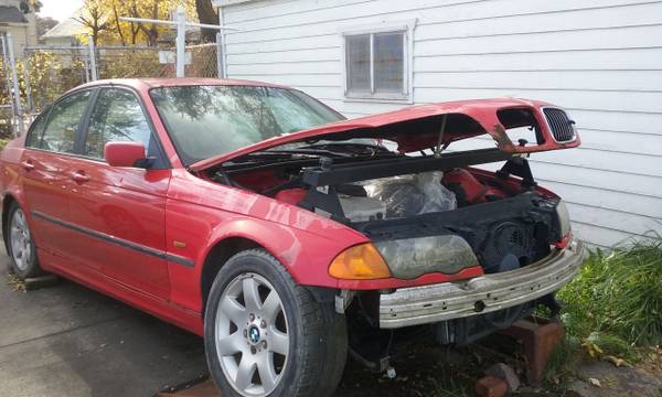 Photo BMW for fix or parts needs assembly bring a trailer with wench $700
