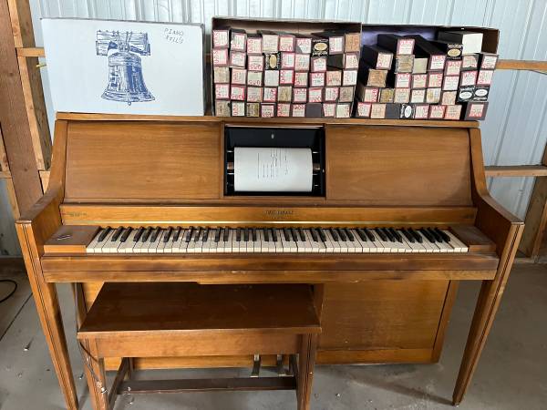 Photo player piano with rolls $85
