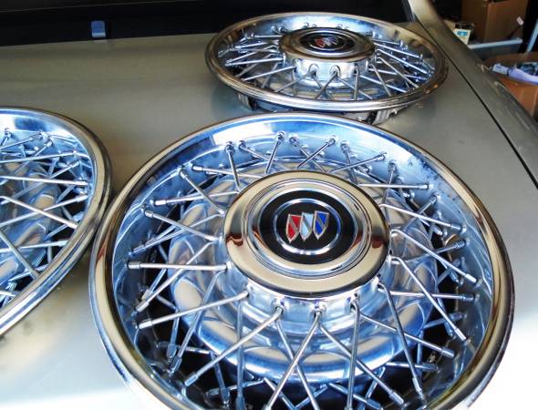 Photo 1987-92 Cadillac Brougham NOS wire wheel covers set $1,500