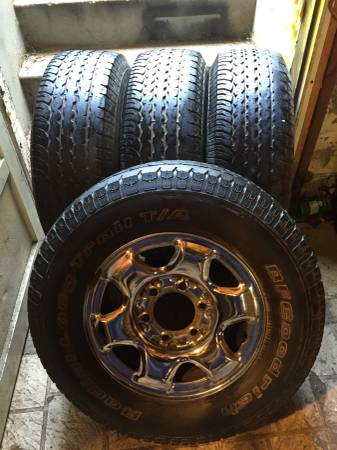 Photo (4) 235-70-15 bf goodrich tires mounted on chrome 6 lug wheels $350