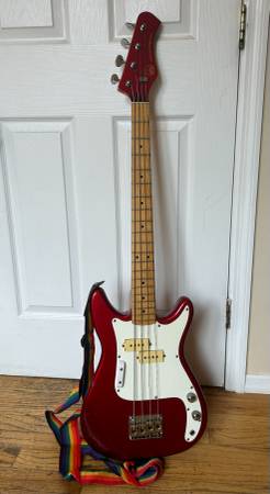 Photo cherry red bass guitar $350
