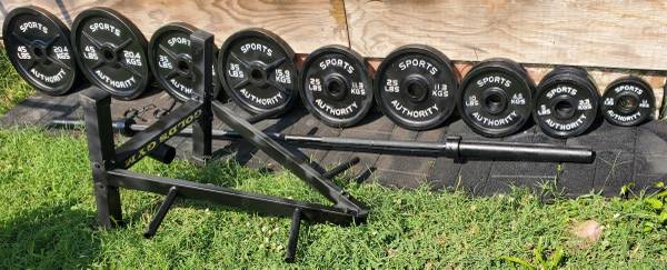 Photo 2 45s 2 35s 2 25s 2 10s 4 5s 2 2.5s, 7 ft 45 lb Olympic Bar and tree $450