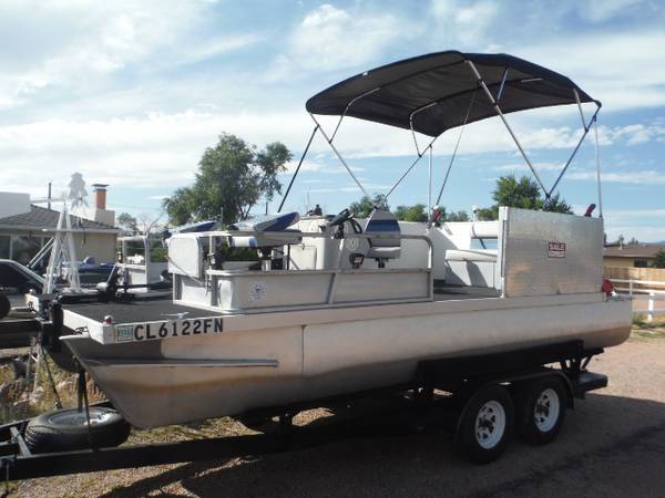 Photo 18ft Lowe Pontoon boat, trailer, 50hp Motor, bimi top and accessorys $7,000