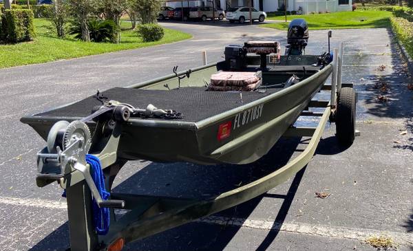 Photo 14 foot Jon boat with 9.9 mercury motor. $4,499