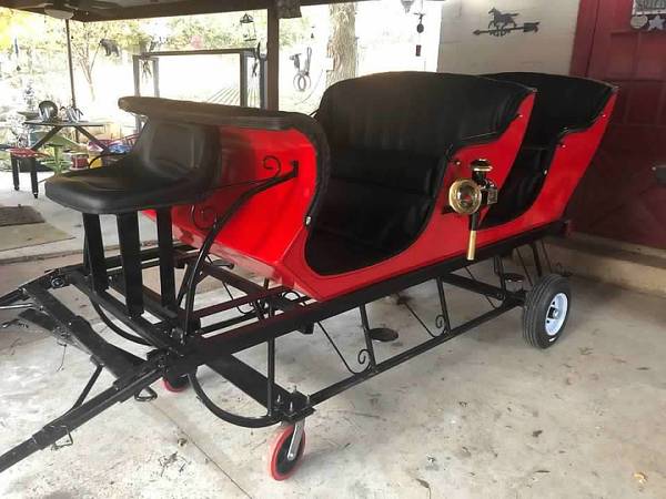 2 seat red sleigh with seat for driver