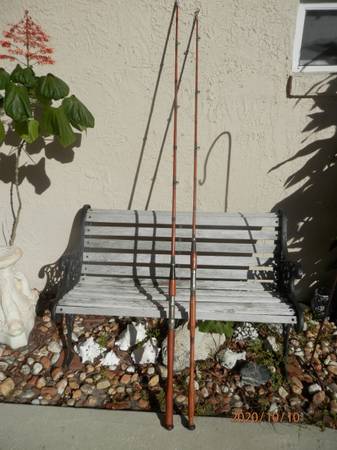 Antique wooden boat or pier fishing rods $75