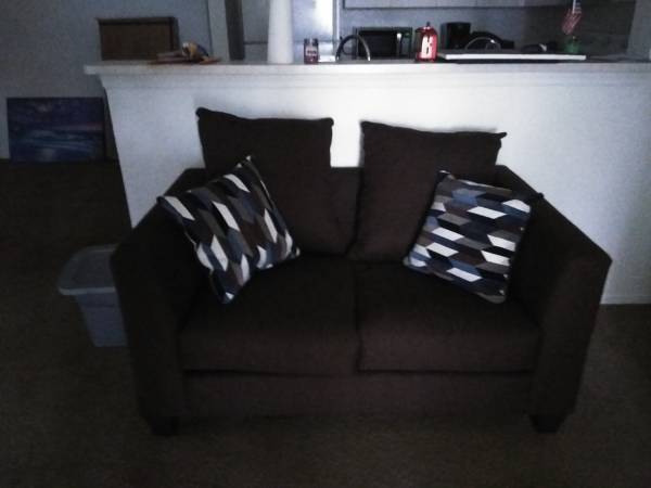Photo Chocolate colored couch, love seat and two end tables $300